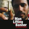 MAN LIFTING BANNER - the revolution continues DoLP MAN LIFTING BANNER - the revolution continues DoLP